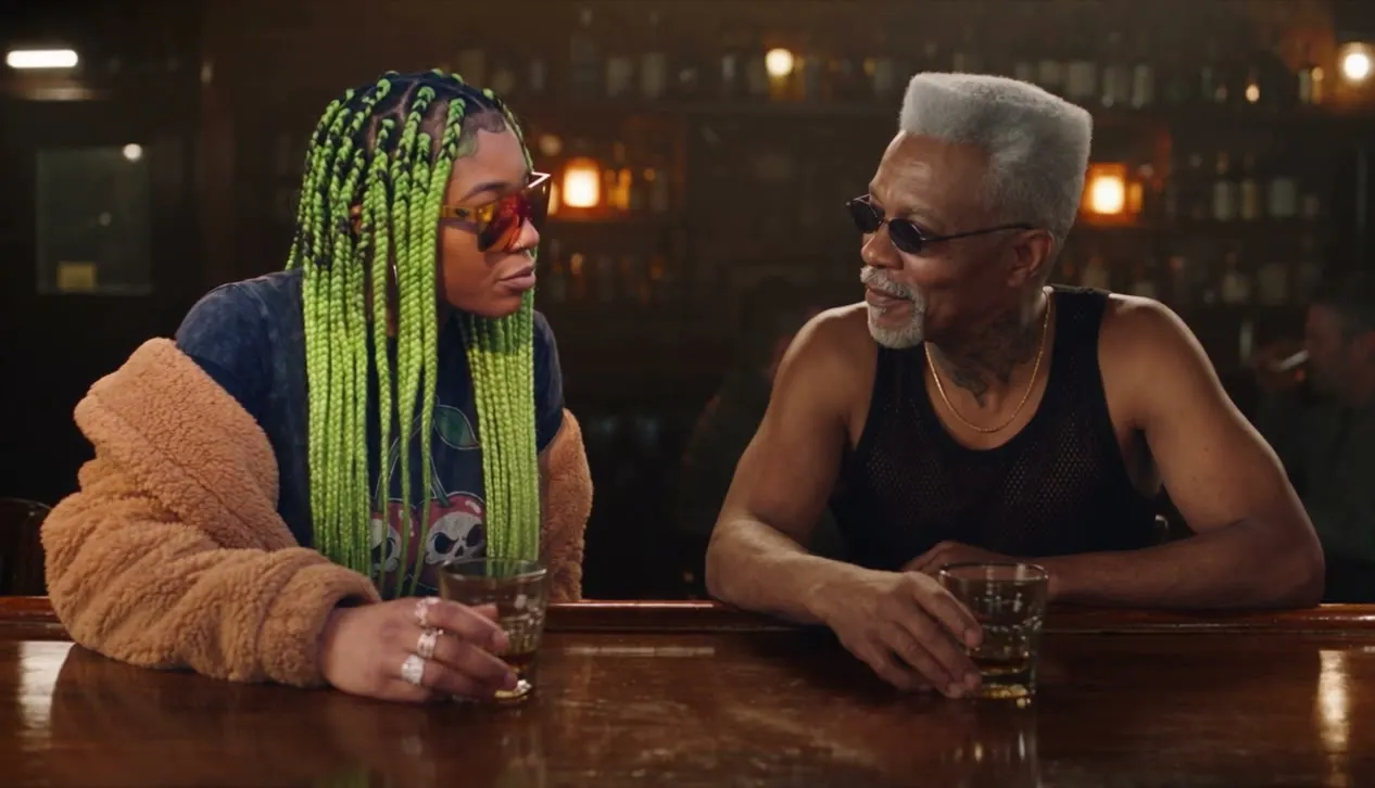 Two people talking over drinks, recast with new actors.