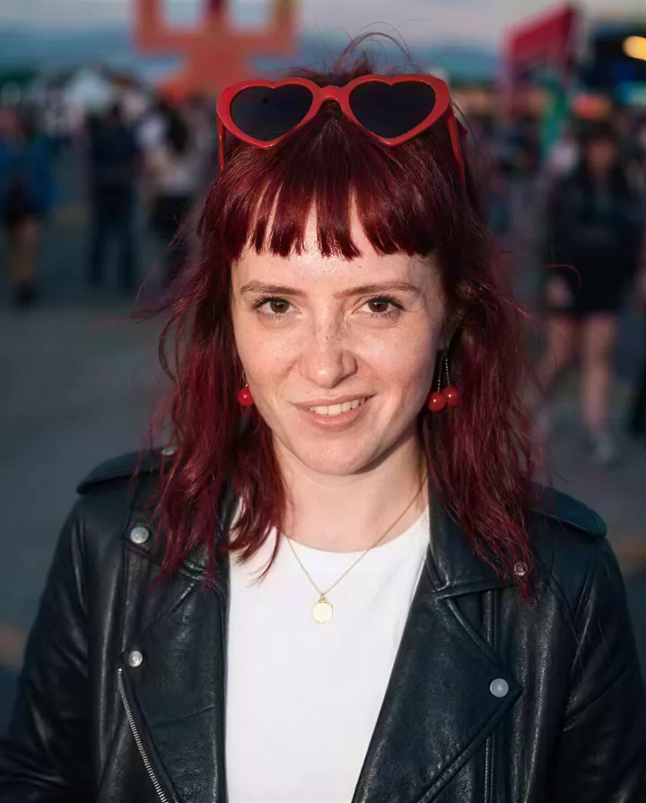 A tiny, blurry festival snapshot comes back sharp at 2K, freckles and all.